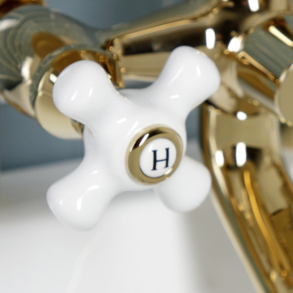 Kingston Three-Handle 2-Hole Deck-Mount Clawfoot Tub Faucet with Hand Shower