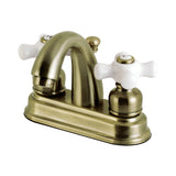 Restoration Two-Handle 3-Hole Deck Mount 4" Centerset Bathroom Faucet with Plastic Pop-Up